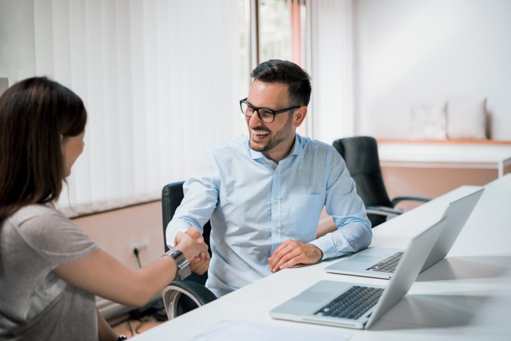 Professional working with lady while seated